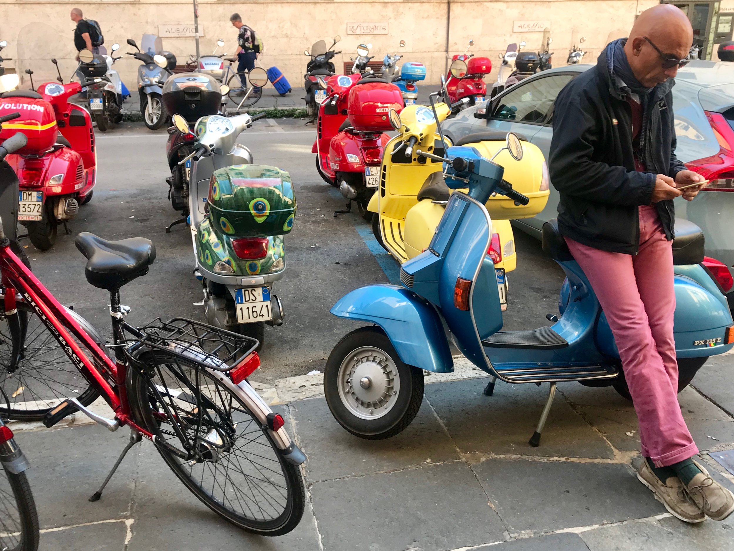 guy in pink pants and motorscooters.jpg